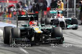 Heikki Kovalainen (FIN) Caterham CT01 and Michael Schumacher (GER) Mercedes AMG F1 W03 leave the pits. 12.05.2012. Formula 1 World Championship, Rd 5, Spanish Grand Prix, Barcelona, Spain, Qualifying Day