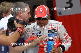 The McLaren press officer Steve Cooper has a word with Lewis Hamilton (GBR), McLaren Mercedes stright after qualifying  12.05.2012. Formula 1 World Championship, Rd 5, Spanish Grand Prix, Barcelona, Spain, Qualifying Day