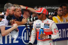 (L to R): Steve Cooper (GBR) McLaren Press Officer talks with pole sitter Lewis Hamilton (GBR) McLaren in parc ferme after qualifying. 12.05.2012. Formula 1 World Championship, Rd 5, Spanish Grand Prix, Barcelona, Spain, Qualifying Day