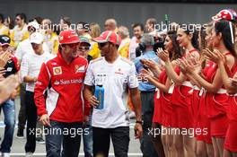 (L to R): Fernando Alonso (ESP) Ferrari and Lewis Hamilton (GBR) McLaren on the drivers parade. 10.05.2012. Formula 1 World Championship, Rd 5, Spanish Grand Prix, Barcelona, Spain, Race Day