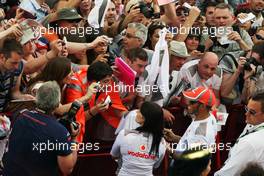 Lewis Hamilton (GBR) McLaren signs autographs for the fans. 10.05.2012. Formula 1 World Championship, Rd 5, Spanish Grand Prix, Barcelona, Spain, Preparation Day