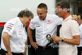 (L to R): Norbert Haug (GER) Mercedes Sporting Director and Martin Whitmarsh (GBR) McLaren Chief Executive Officer celebrate 300 Grands Prix partnership with McLaren and Mercedes. 22.06.2012. Formula 1 World Championship, Rd 8, European Grand Prix, Valencia, Spain, Practice Day