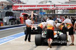 Nico Hulkenberg (GER) Sahara Force India F1 VJM05 and Paul di Resta (GBR) Sahara Force India VJM05 in the pits. 22.06.2012. Formula 1 World Championship, Rd 8, European Grand Prix, Valencia, Spain, Practice Day