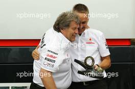 (L to R):Norbert Haug (GER) Mercedes Sporting Director and Martin Whitmarsh (GBR) McLaren Chief Executive Officer with wheel nuts from the winning McLaren cars of David Coulthard (GBR) in 1997 and Lewis Hamilton (GBR) McLaren in 2012. 22.06.2012. Formula 1 World Championship, Rd 8, European Grand Prix, Valencia, Spain, Practice Day