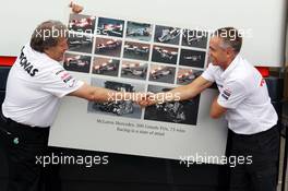 (L to R): Norbert Haug (GER) Mercedes Sporting Director and Martin Whitmarsh (GBR) McLaren Chief Executive Officer celebrate 300 Grands Prix partnership with McLaren and Mercedes. 22.06.2012. Formula 1 World Championship, Rd 8, European Grand Prix, Valencia, Spain, Practice Day