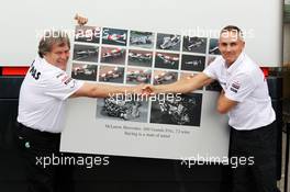 (L to R): Norbert Haug (GER) Mercedes Sporting Director and Martin Whitmarsh (GBR) McLaren Chief Executive Officer celebrate 300 Grands Prix partnership with McLaren and Mercedes. 22.06.2012. Formula 1 World Championship, Rd 8, European Grand Prix, Valencia, Spain, Practice Day