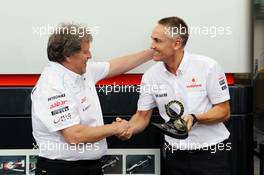 (L to R): Norbert Haug (GER) Mercedes Sporting Director and Martin Whitmarsh (GBR) McLaren Chief Executive Officer celebrate 300 Grands Prix partnership with McLaren and Mercedes. 22.06.2012. Formula 1 World Championship, Rd 8, European Grand Prix, Valencia, Spain, Practice Day