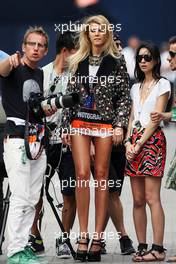 A glamorous woman wearing a photographer's tabard. 22.06.2012. Formula 1 World Championship, Rd 8, European Grand Prix, Valencia, Spain, Practice Day