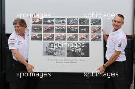 (L to R): Norbert Haug (GER) Mercedes Sporting Director and Martin Whitmarsh (GBR) McLaren Chief Executive Officer celebrate 300 Grands Prix partnership with McLaren and Mercedes. 22.06.2012. Formula 1 World Championship, Rd 8, European Grand Prix, Valencia, Spain, Practice Day