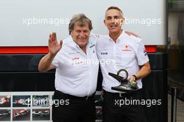 (L to R):Norbert Haug (GER) Mercedes Sporting Director and Martin Whitmarsh (GBR) McLaren Chief Executive Officer with wheel nuts from the winning McLaren cars of David Coulthard (GBR) in 1997 and Lewis Hamilton (GBR) McLaren in 2012. 22.06.2012. Formula 1 World Championship, Rd 8, European Grand Prix, Valencia, Spain, Practice Day