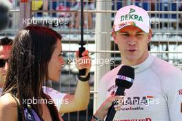 Marion Jolles (FRA) TF1 TV Presenter with Nico Hulkenberg (GER) Sahara Force India F1 on the grid. 24.06.2012. Formula 1 World Championship, Rd 8, European Grand Prix, Valencia, Spain, Race Day