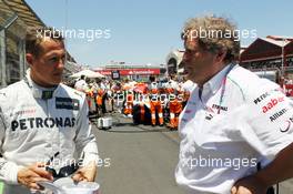 (L to R): Michael Schumacher (GER) Mercedes AMG F1 with Norbert Haug (GER) Mercedes Sporting Director on the grid. 24.06.2012. Formula 1 World Championship, Rd 8, European Grand Prix, Valencia, Spain, Race Day