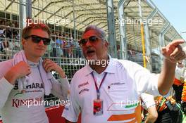 (L to R): Nico Hulkenberg (GER) Sahara Force India F1 with Dr. Vijay Mallya (IND) Sahara Force India F1 Team Owner on the grid. 24.06.2012. Formula 1 World Championship, Rd 8, European Grand Prix, Valencia, Spain, Race Day