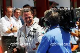 Michael Schumacher (GER) Mercedes AMG F1 celebrates his third position in parc ferme. 24.06.2012. Formula 1 World Championship, Rd 8, European Grand Prix, Valencia, Spain, Race Day