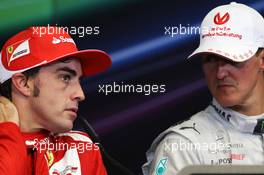 (L to R): Race winner Fernando Alonso (ESP) Ferrari with Michael Schumacher (GER) Mercedes AMG F1 in the FIA Press Conference. 24.06.2012. Formula 1 World Championship, Rd 8, European Grand Prix, Valencia, Spain, Race Day