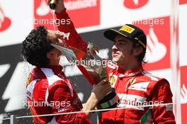 Race winner Fernando Alonso (ESP) Ferrari celebrates on the podium with Andrea Stella (ITA) Ferrari Race Engineer. 24.06.2012. Formula 1 World Championship, Rd 8, European Grand Prix, Valencia, Spain, Race Day
