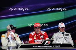 The post race FIA Press Conference Kimi Raikkonen (FIN) Lotus F1 Team, second; Fernando Alonso (ESP) Ferrari, race winner; Michael Schumacher (GER) Mercedes AMG F1, third. 24.06.2012. Formula 1 World Championship, Rd 8, European Grand Prix, Valencia, Spain, Race Day