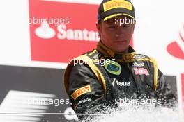 Kimi Raikkonen (FIN) Lotus F1 Team celebrates his second position on the podium. 24.06.2012. Formula 1 World Championship, Rd 8, European Grand Prix, Valencia, Spain, Race Day