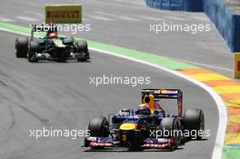 Mark Webber (AUS) Red Bull Racing RB8 leads Heikki Kovalainen (FIN) Caterham CT01. 24.06.2012. Formula 1 World Championship, Rd 8, European Grand Prix, Valencia, Spain, Race Day