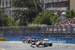 Nico Hulkenberg (GER) Sahara Force India F1 VJM05 leads Jenson Button (GBR) McLaren MP4/27. 24.06.2012. Formula 1 World Championship, Rd 8, European Grand Prix, Valencia, Spain, Race Day
