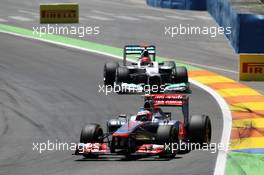 Jenson Button (GBR) McLaren MP4/27 leads Michael Schumacher (GER) Mercedes AMG F1 W03. 24.06.2012. Formula 1 World Championship, Rd 8, European Grand Prix, Valencia, Spain, Race Day