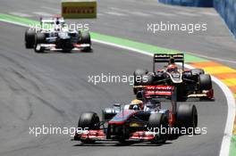 Lewis Hamilton (GBR) McLaren MP4/27 leads Romain Grosjean (FRA) Lotus F1 E20. 24.06.2012. Formula 1 World Championship, Rd 8, European Grand Prix, Valencia, Spain, Race Day