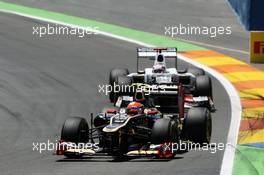 Romain Grosjean (FRA) Lotus F1 E20 leads Kamui Kobayashi (JPN) Sauber C31. 24.06.2012. Formula 1 World Championship, Rd 8, European Grand Prix, Valencia, Spain, Race Day