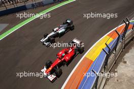 Fernando Alonso (ESP) Ferrari F2012 and Michael Schumacher (GER) Mercedes AMG F1 W03 battle for position. 24.06.2012. Formula 1 World Championship, Rd 8, European Grand Prix, Valencia, Spain, Race Day