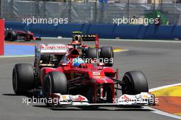 Fernando Alonso (ESP) Ferrari F2012 leads Romain Grosjean (FRA) Lotus F1 E20. 24.06.2012. Formula 1 World Championship, Rd 8, European Grand Prix, Valencia, Spain, Race Day