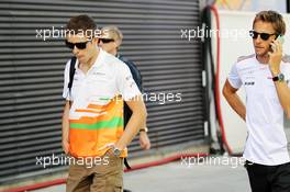 (L to R): Paul di Resta (GBR) Sahara Force India F1 with Jenson Button (GBR) McLaren. 23.06.2012. Formula 1 World Championship, Rd 8, European Grand Prix, Valencia, Spain, Qualifying Day