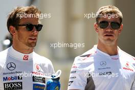 (L to R): Jenson Button (GBR) McLaren with Mike Collier (GBR) Personal Trainer. 23.06.2012. Formula 1 World Championship, Rd 8, European Grand Prix, Valencia, Spain, Qualifying Day