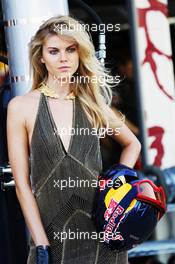A glamorous woman with a Red Bull Racing mechanic's helmet. 23.06.2012. Formula 1 World Championship, Rd 8, European Grand Prix, Valencia, Spain, Qualifying Day