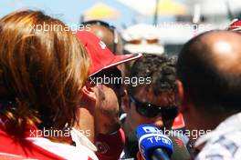 Fernando Alonso (ESP) Ferrari with the media. 23.06.2012. Formula 1 World Championship, Rd 8, European Grand Prix, Valencia, Spain, Qualifying Day