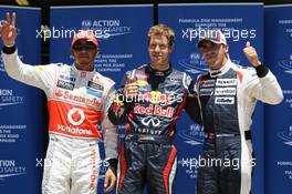 pole postion for Sebastian Vettel (GER), Red Bull Racing with Lewis Hamilton (GBR), McLaren Mercedes in 2nd place and 3rd Pastor Maldonado (VEN), Williams F1 Team  23.06.2012. Formula 1 World Championship, Rd 8, European Grand Prix, Valencia, Spain, Qualifying Day