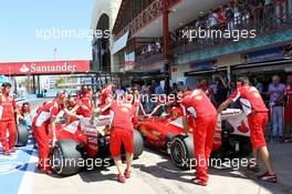 (L to R): Felipe Massa (BRA) Ferrari F2012 and team mate Fernando Alonso (ESP) Ferrari F2012 in the pits. 23.06.2012. Formula 1 World Championship, Rd 8, European Grand Prix, Valencia, Spain, Qualifying Day