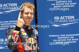 Sebastian Vettel (GER) Red Bull Racing celebrates his pole position in parc ferme. 23.06.2012. Formula 1 World Championship, Rd 8, European Grand Prix, Valencia, Spain, Qualifying Day