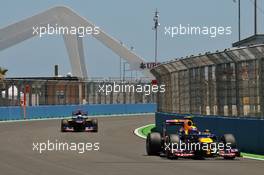 Mark Webber (AUS) Red Bull Racing RB8 leads Daniel Ricciardo (AUS) Scuderia Toro Rosso STR7. 23.06.2012. Formula 1 World Championship, Rd 8, European Grand Prix, Valencia, Spain, Qualifying Day