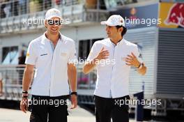 (L to R): Dani Clos (ESP) HRT Formula One Team Test Driver with Pedro De La Rosa (ESP) HRT Formula 1 Team. 24.06.2012. Formula 1 World Championship, Rd 8, European Grand Prix, Valencia, Spain, Race Day