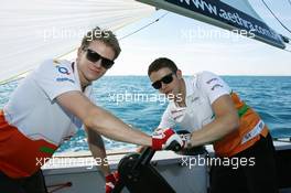 (L to R): Nico Hulkenberg (GER) Sahara Force India F1 and Paul di Resta (GBR) Sahara Force India F1 on the Aethra America's Cup Boat. 21.06.2012. Formula 1 World Championship, Rd 8, European Grand Prix, Valencia, Spain, Preparation Day