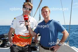 (L to R): Nico Hulkenberg (GER) Sahara Force India F1 with Simon Lazenby (GBR) Sky Sports F1 TV Presenter on the Aethra America's Cup Boat. 21.06.2012. Formula 1 World Championship, Rd 8, European Grand Prix, Valencia, Spain, Preparation Day