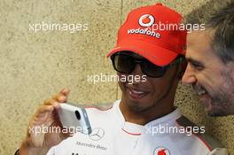 Lewis Hamilton (GBR) McLaren with Adam Cooper (GBR) McLaren Press Officer. 21.06.2012. Formula 1 World Championship, Rd 8, European Grand Prix, Valencia, Spain, Preparation Day