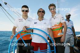 Paul di Resta (GBR) Sahara Force India F1 with Robert Fearnley (GBR) Sahara Force India F1 Team Deputy Team Principal and Nico Hulkenberg (GER) Sahara Force India F1 on the Aethra America's Cup Boat. 21.06.2012. Formula 1 World Championship, Rd 8, European Grand Prix, Valencia, Spain, Preparation Day