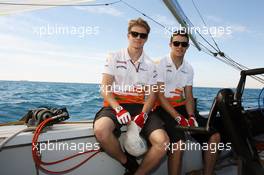 (L to R): Nico Hulkenberg (GER) Sahara Force India F1 and Paul di Resta (GBR) Sahara Force India F1 on the Aethra America's Cup Boat. 21.06.2012. Formula 1 World Championship, Rd 8, European Grand Prix, Valencia, Spain, Preparation Day