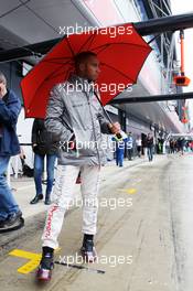 Lewis Hamilton (GBR) McLaren with his umbrella in the pits. 06.07.2012. Formula 1 World Championship, Rd 9, British Grand Prix, Silverstone, England, Practice Day