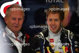 (L to R): Dr Helmut Marko (AUT) Red Bull Motorsport Consultant with Sebastian Vettel (GER) Red Bull Racing. 06.07.2012. Formula 1 World Championship, Rd 9, British Grand Prix, Silverstone, England, Practice Day