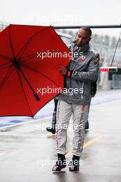 Lewis Hamilton (GBR) McLaren loses control of his umbrella in the pits. 06.07.2012. Formula 1 World Championship, Rd 9, British Grand Prix, Silverstone, England, Practice Day