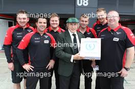 Jackie Stewart (GBR) supports the Grand Prix Mechanics Charitable Trust 25 Year Anniversary with the Marussia F1 Team. 05.07.2012. Formula 1 World Championship, Rd 9, British Grand Prix, Silverstone, England, Preparation Day