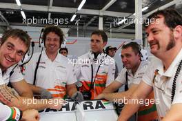 Will Hings (GBR) Sahara Force India F1 Press Officer with Sahara Force India F1 Team mechanics. 06.07.2012. Formula 1 World Championship, Rd 9, British Grand Prix, Silverstone, England, Practice Day