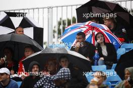 Fans brave the rain in the grandstands. 06.07.2012. Formula 1 World Championship, Rd 9, British Grand Prix, Silverstone, England, Practice Day