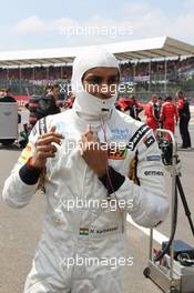 Narain Karthikeyan (IND) Hispania Racing F1 Team (HRT) on the grid. 08.07.2012. Formula 1 World Championship, Rd 9, British Grand Prix, Silverstone, England, Race Day